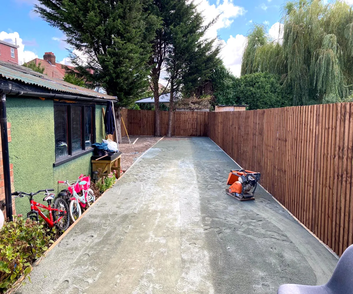 Before: the same garden with cracked concrete